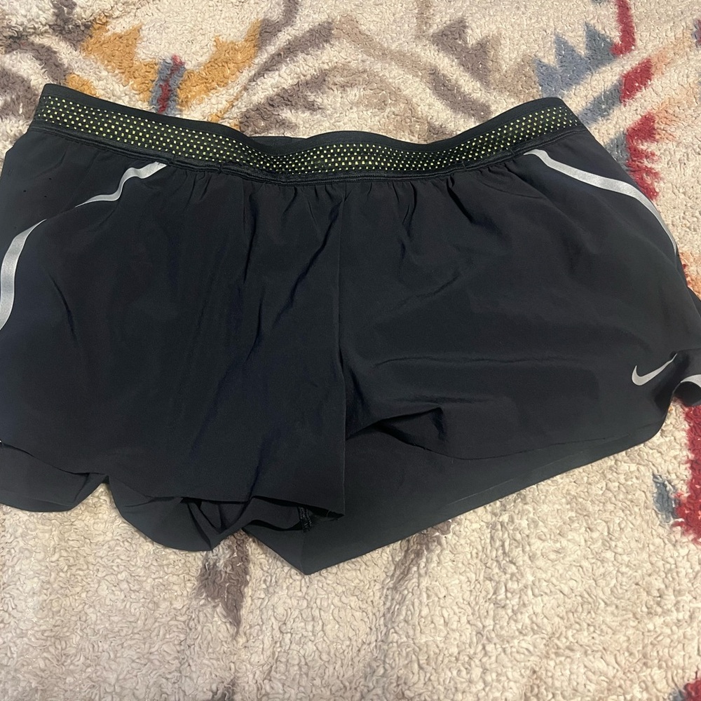Nike Black Women's Athletic Shorts with Yellow Accents